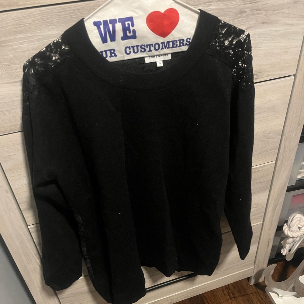 Brand new black fully laced back sweater
